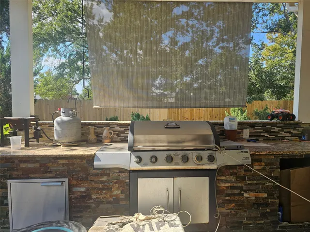 a stove top oven sitting inside of a kitchen
