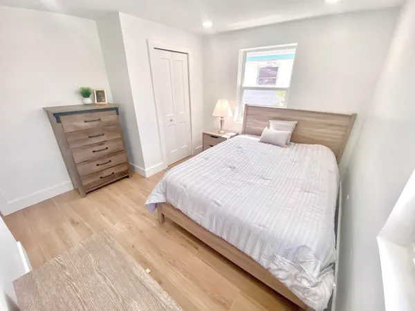 a bedroom with a bed and furniture