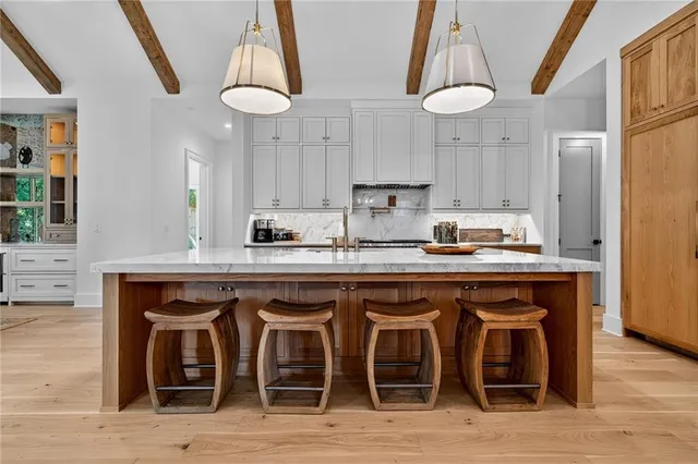a kitchen with a sink cabinets and window
