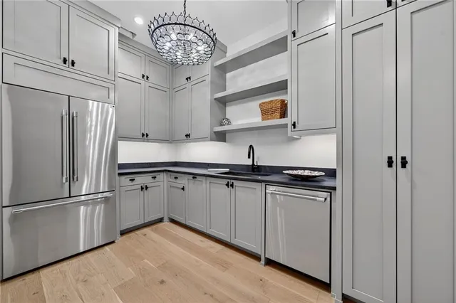 a work room with furniture and large windows