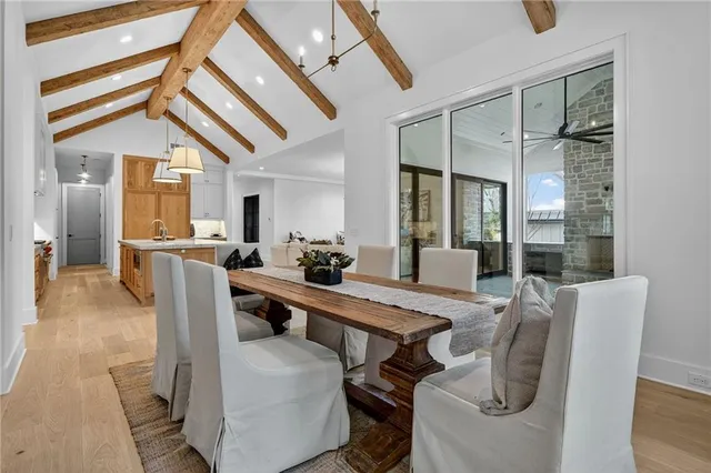 a front view of a house with wooden floor and a potted plant