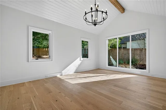 a view of a room with wooden floor