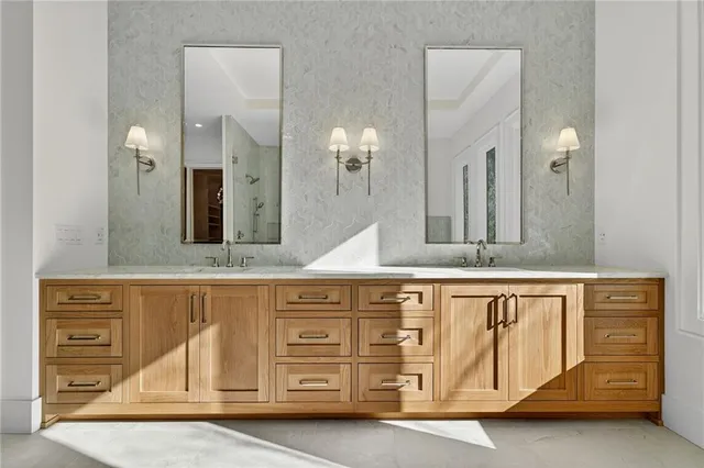 a large spacious bathroom with double vanity and a bathtub