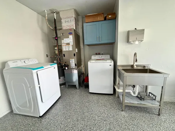 a utility room with dryer and washer