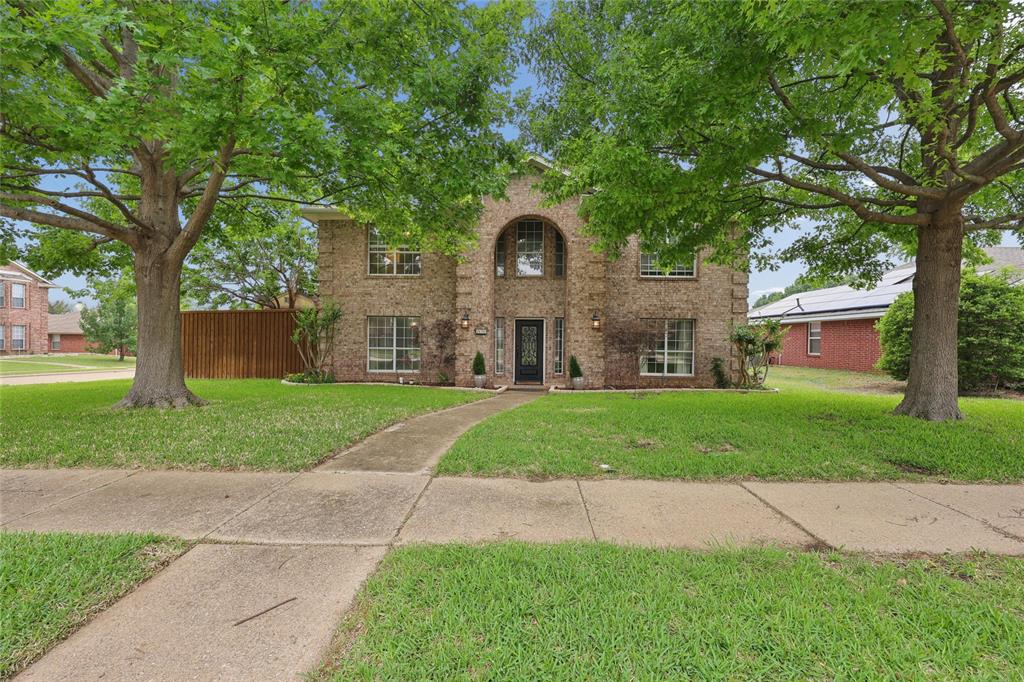 828 Rockefeller Lane Allen, TX 75002 - Photo 2 of 31 a front view of a house with yard and green space
