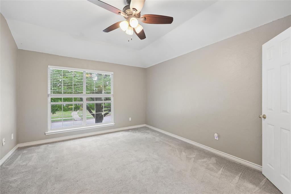 828 Rockefeller Lane Allen, TX 75002 - Photo 22 of 31 an empty room with windows and fan