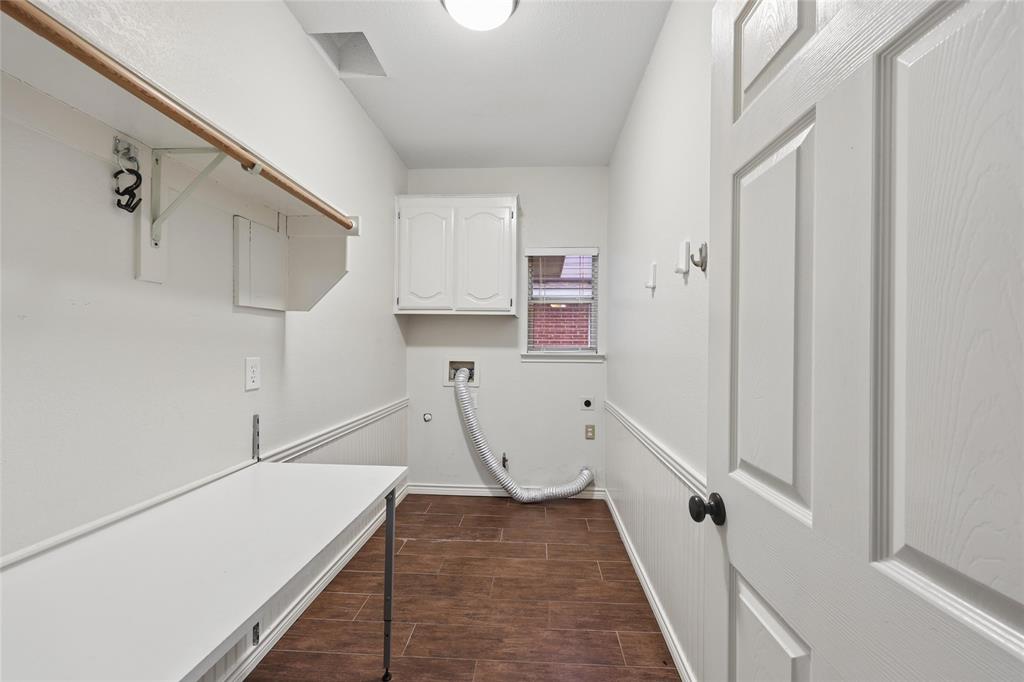 828 Rockefeller Lane Allen, TX 75002 - Photo 25 of 31 a view of a kitchen with furniture and wooden floor