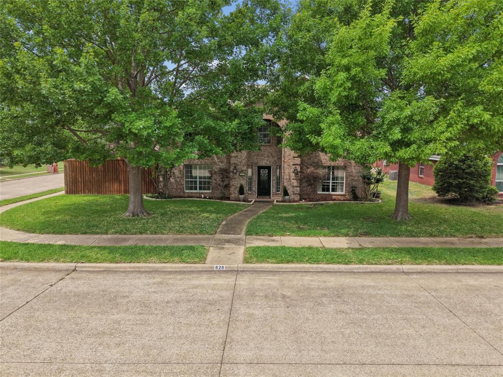 828 Rockefeller Lane Allen, TX 75002 - Photo 4 of 31 a view of a house with a big yard and large trees