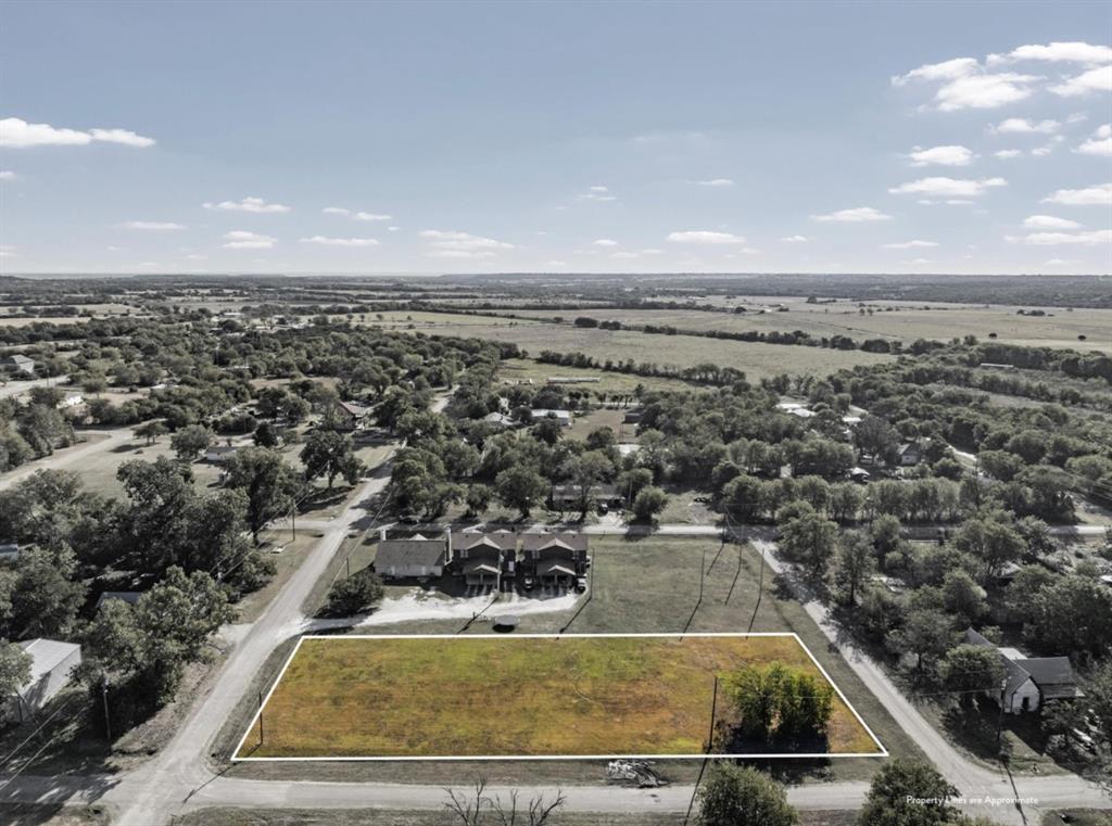 1-5 Shepherd Street Morgan, TX 76671 - Photo 2 of 10 an aerial view of a pool