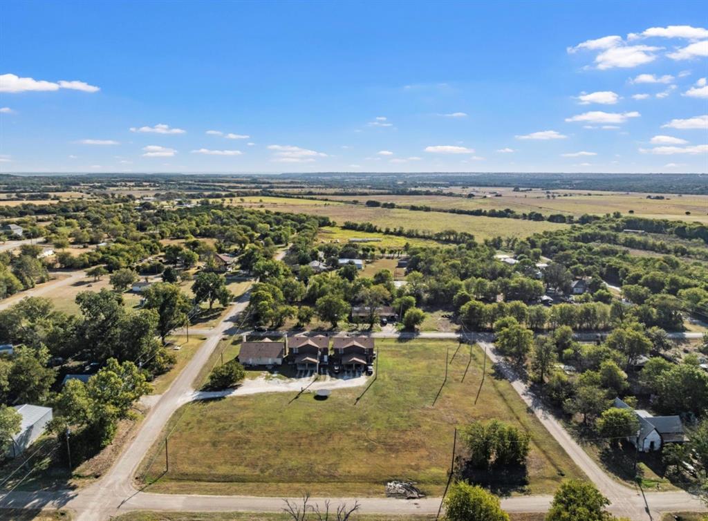 1-5 Shepherd Street Morgan, TX 76671 - Photo 3 of 10 an aerial view of residential houses with outdoor space