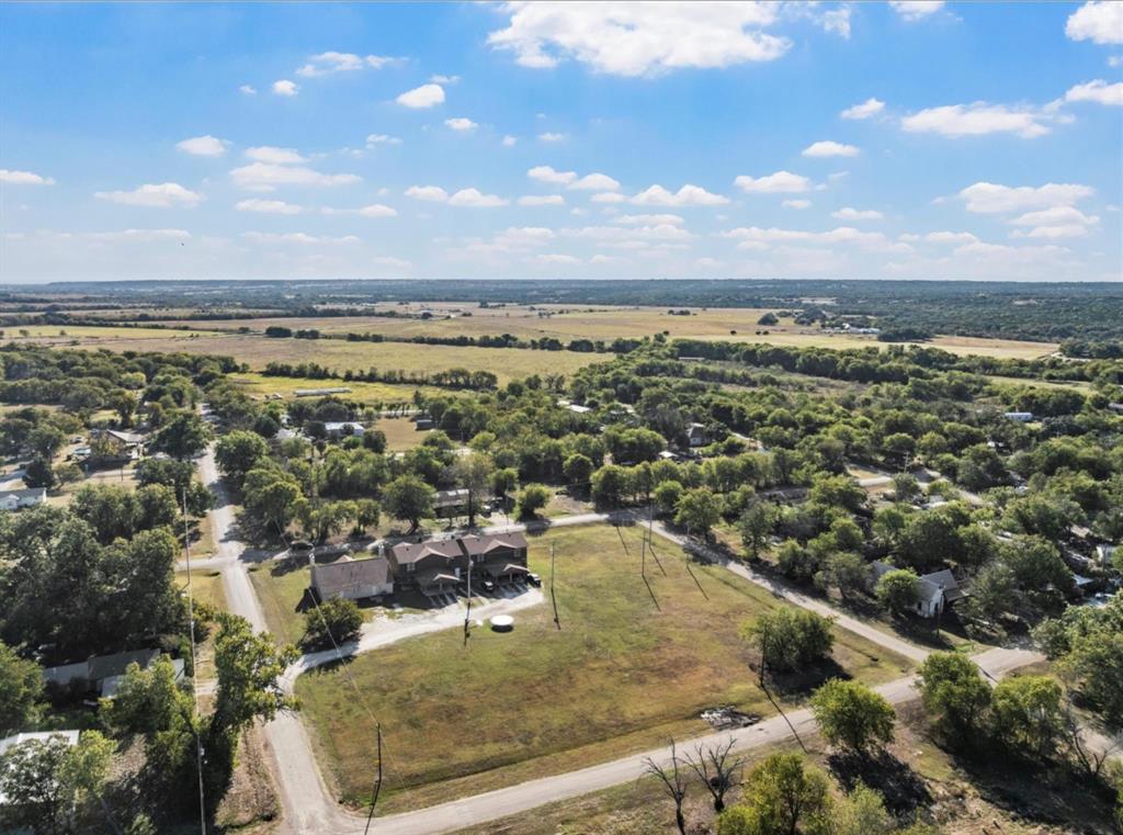 1-5 Shepherd Street Morgan, TX 76671 - Photo 4 of 10 an aerial view of residential houses with outdoor space