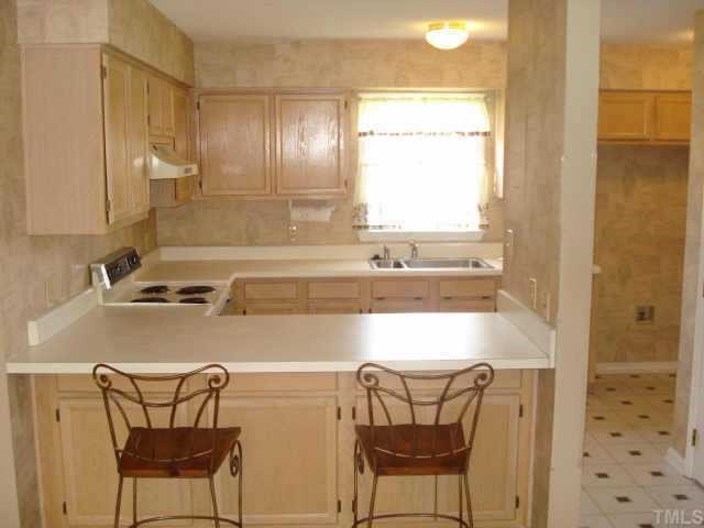 4500 Emmit Drive Raleigh, NC 27604 - Photo 2 of 10 a kitchen with a table and chairs
