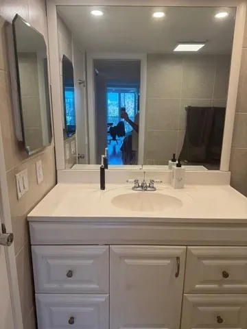 a bathroom with a sink and a mirror