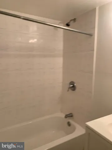 a bathroom with a shower and a bathtub