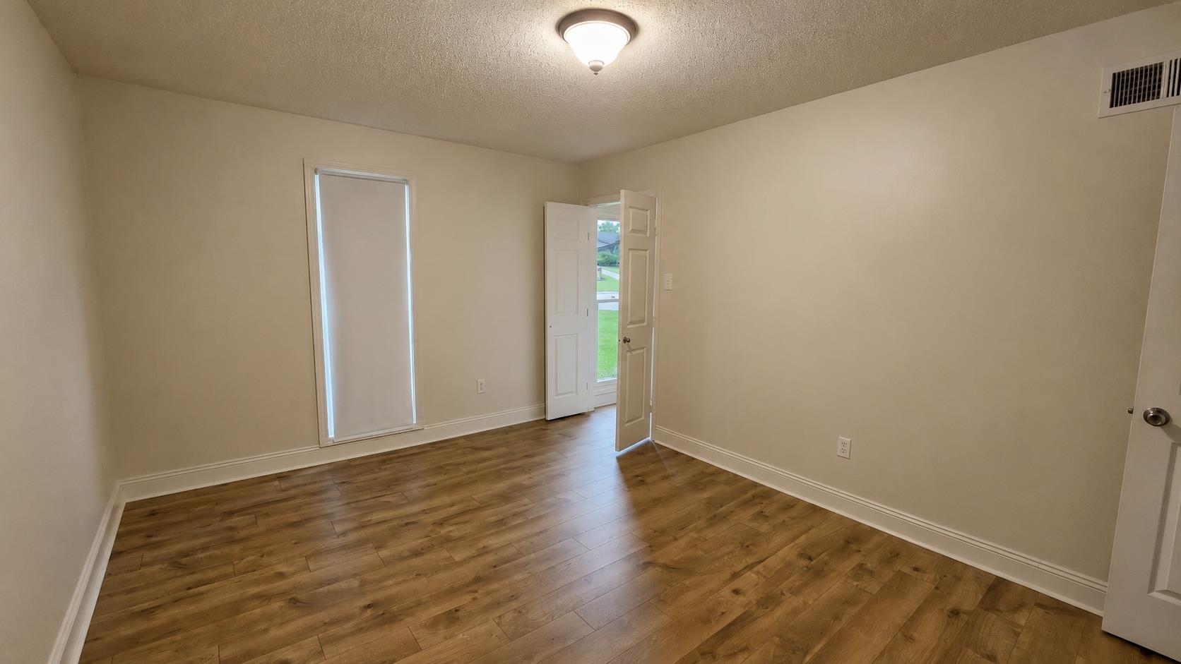 89 Ericson Road Memphis, TN 38018 - Photo 26 of 36 a view of an empty room with wooden floor