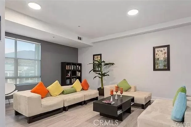 a living room with furniture and a large window