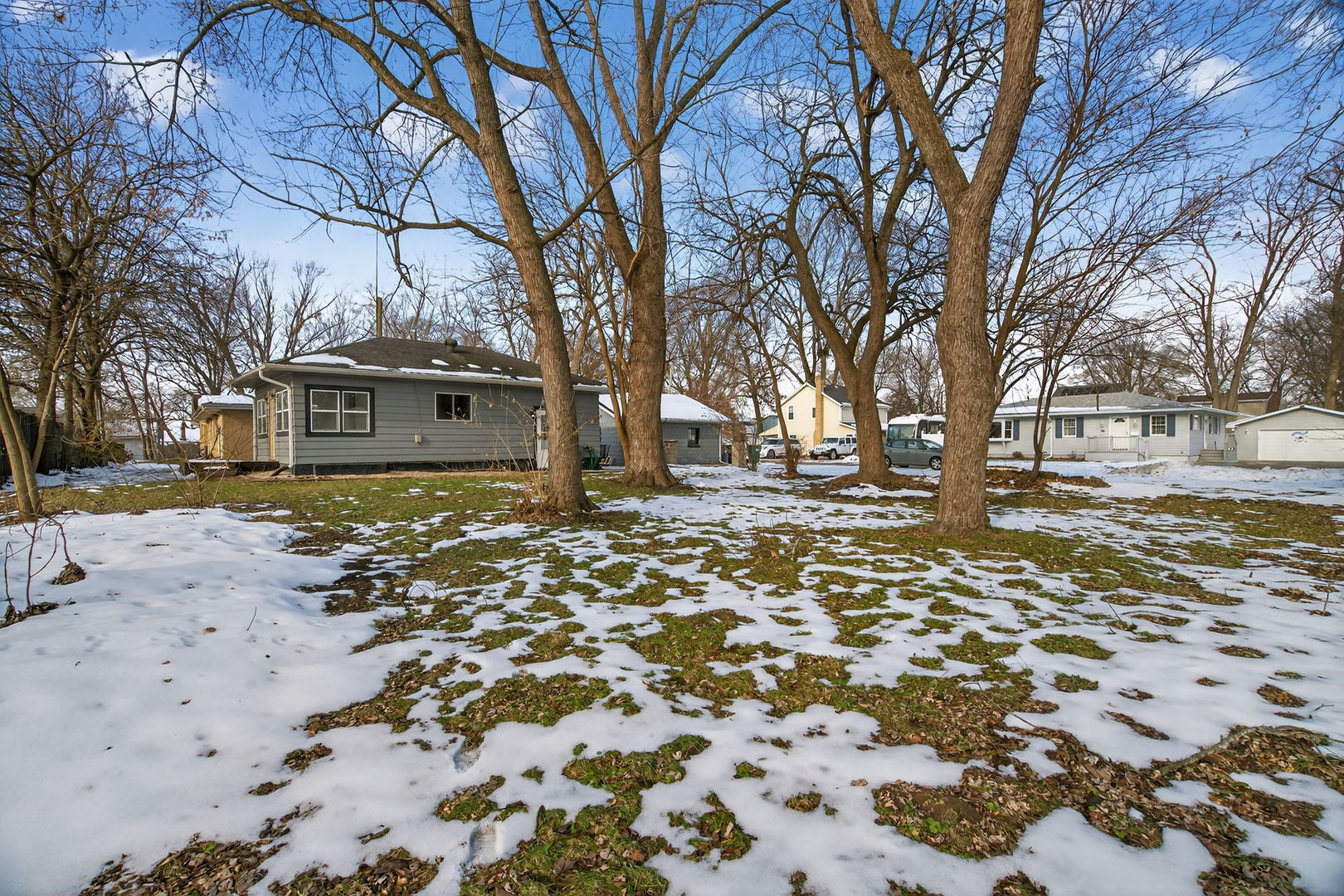 525 Byron Street Wilmington, IL 60481 - Photo 15 of 19 a front view of a building with large trees