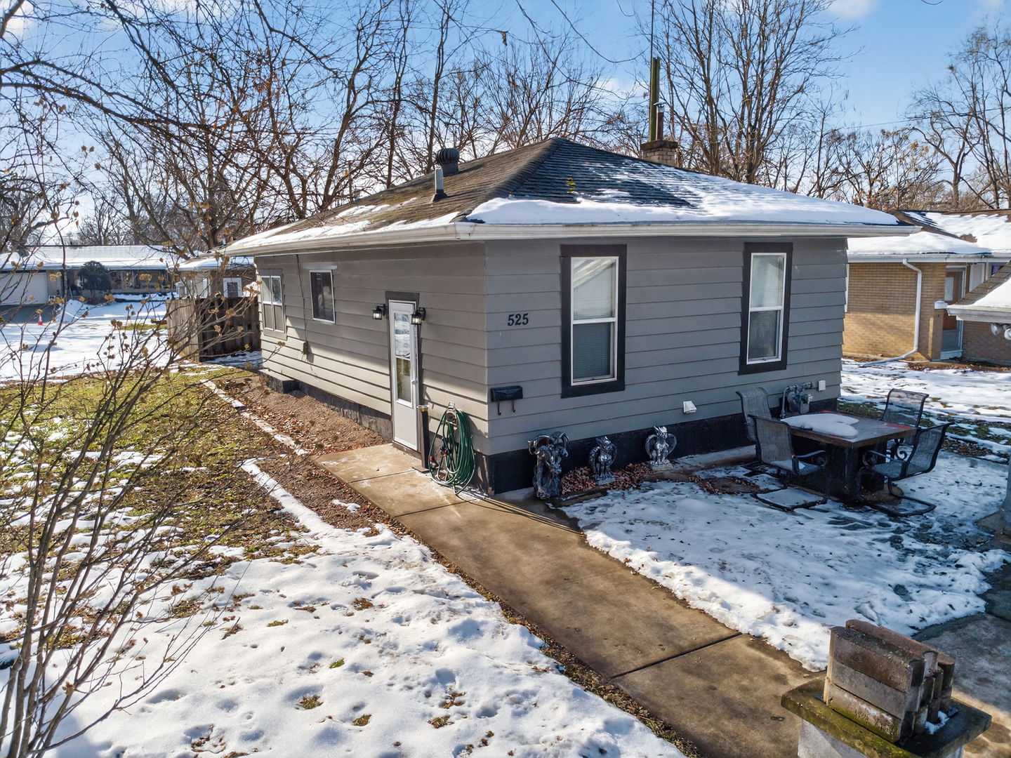 525 Byron Street Wilmington, IL 60481 - Photo 4 of 19 a front view of a house with two chairs in a patio