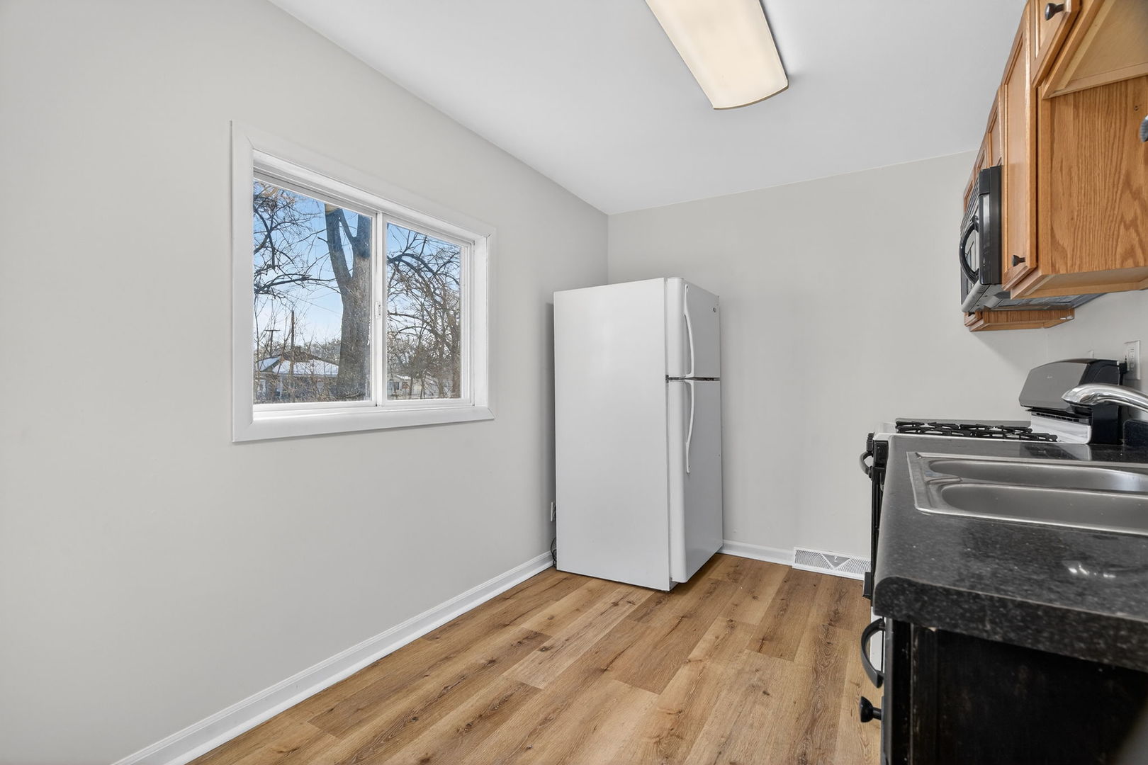 525 Byron Street Wilmington, IL 60481 - Photo 5 of 19 a view of an empty room with a fireplace