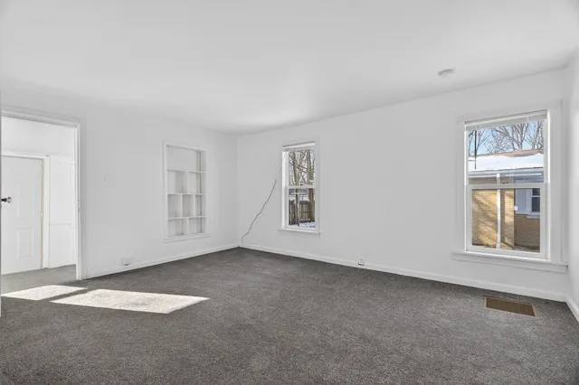 an empty room with windows