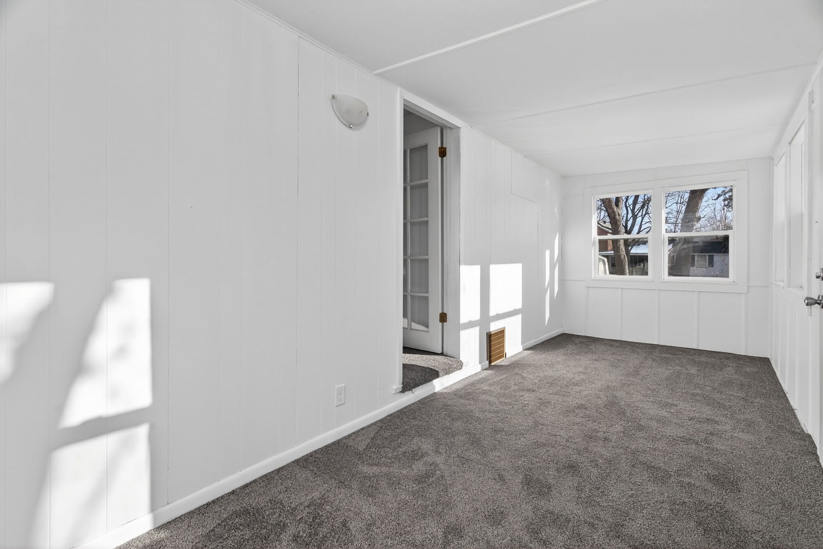 525 Byron Street Wilmington, IL 60481 - Photo 9 of 19 a view of a big room with windows and cabinet