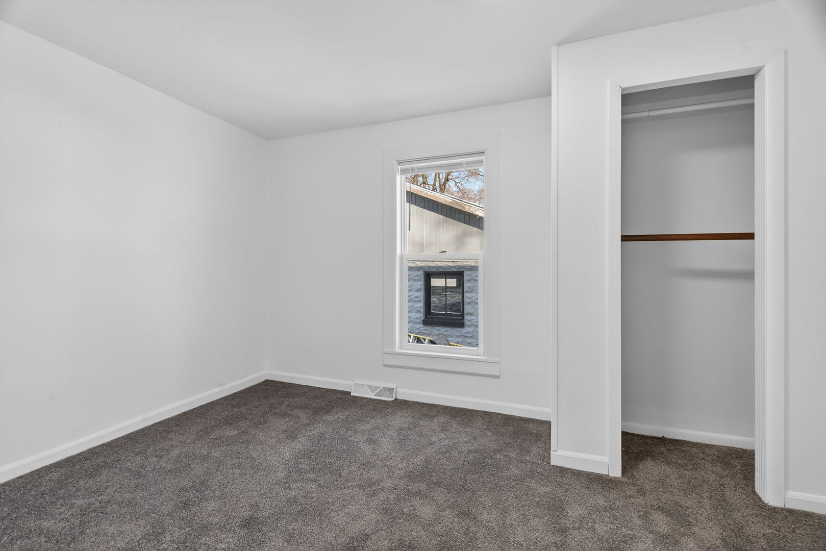 525 Byron Street Wilmington, IL 60481 - Photo 10 of 19 a view of an empty room with a window