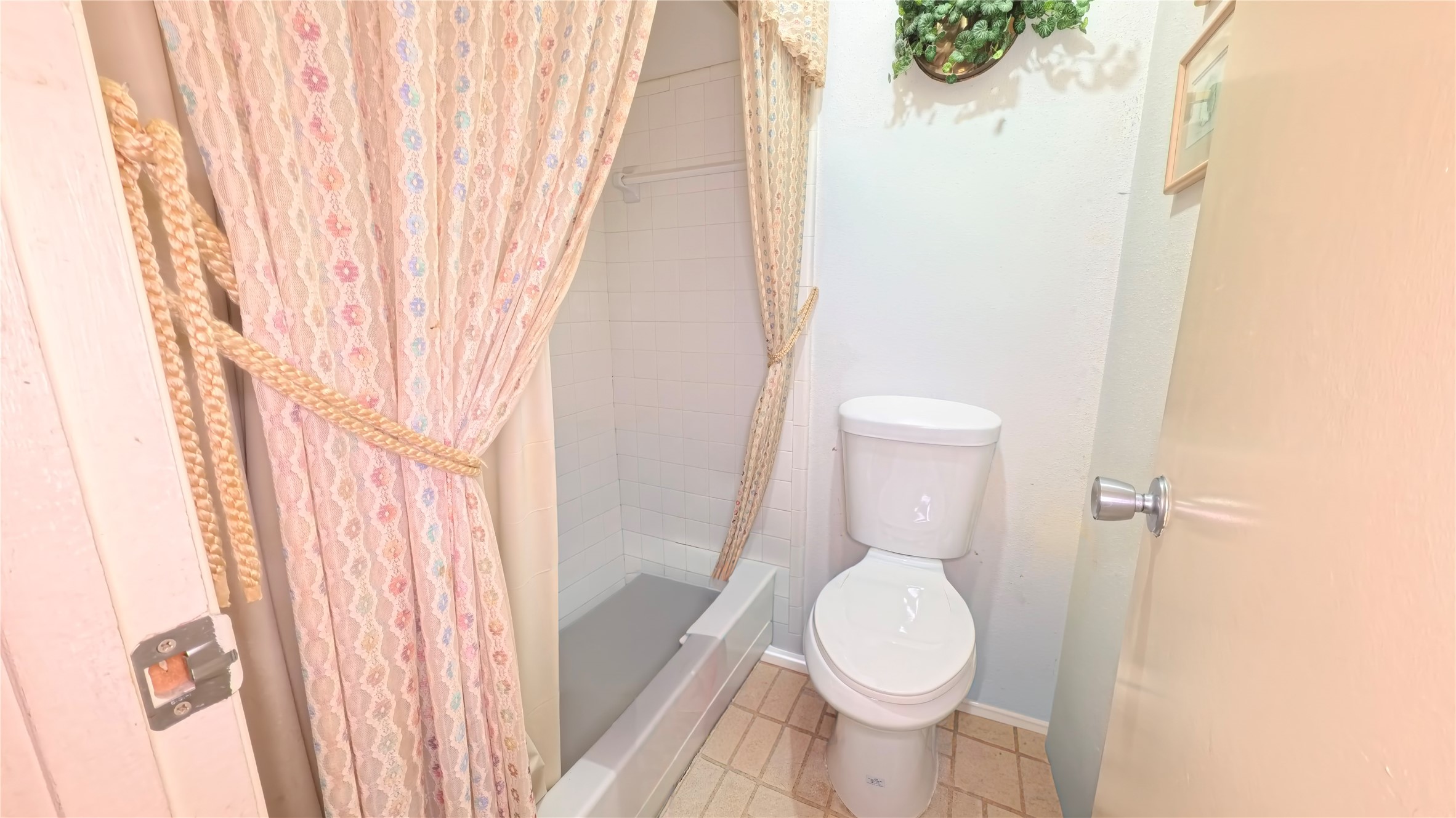 8650 Maplecrest Drive Houston, TX 77099 - Photo 11 of 15 a white toilet sitting next to a white tub