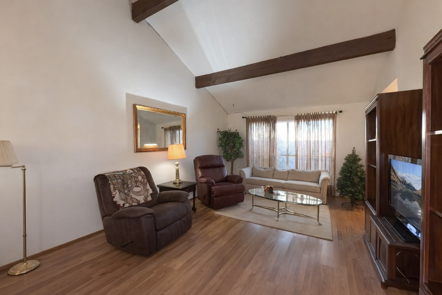 8650 Maplecrest Drive Houston, TX 77099 - Photo 3 of 15 a living room with furniture flat screen tv and wooden floor