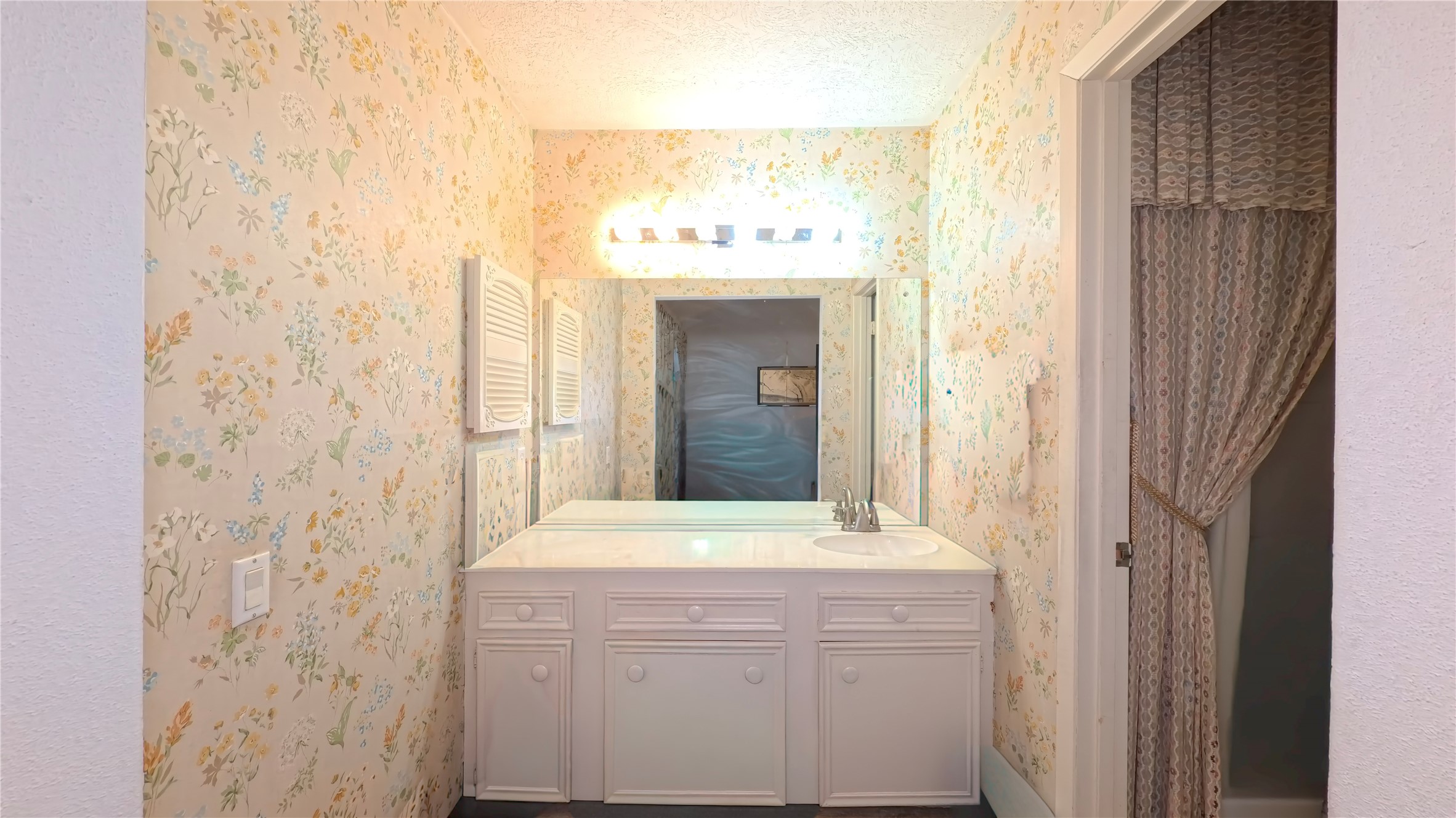 8650 Maplecrest Drive Houston, TX 77099 - Photo 10 of 15 a bathroom with a sink and a mirror