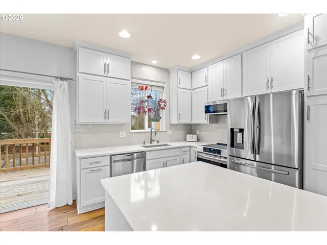 a kitchen with refrigerator cabinets and furniture