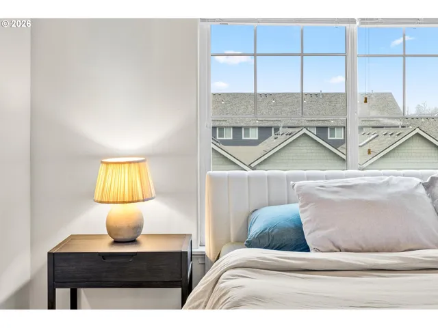 a living room with a couch and next to a window