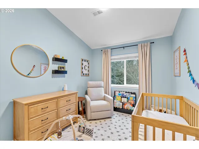 a bedroom with furniture and a window