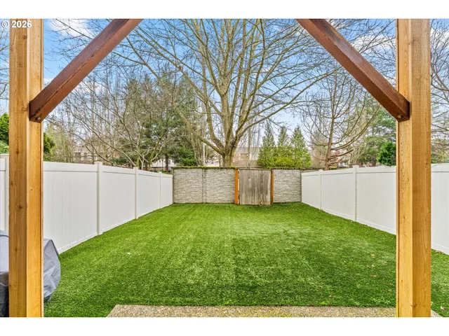 a view of a backyard with a small cabin