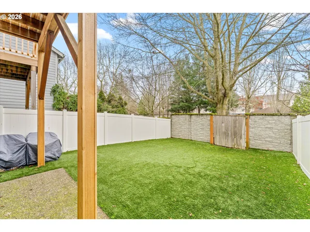 an aerial view of a house with a yard balcony
