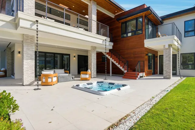 a outdoor space with patio couch and a fire pit