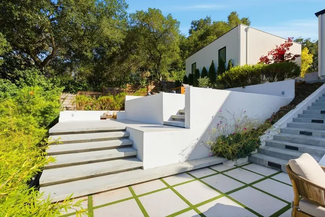 a outdoor space with patio the couches and a dining table with garden view