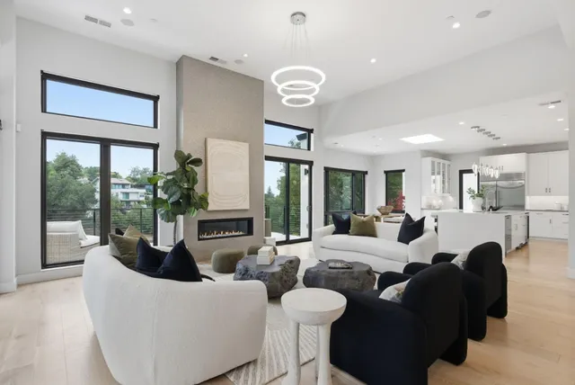 a large bedroom with a bed and a large window