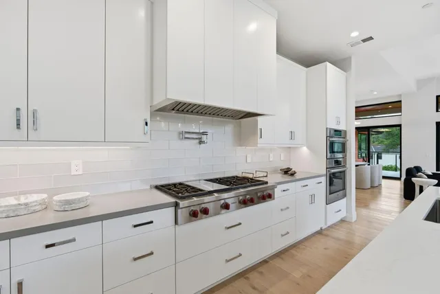 a bathroom with a double vanity sink mirror and shower