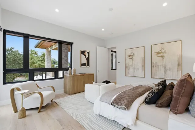 a bathroom with a double vanity sink toilet and shower