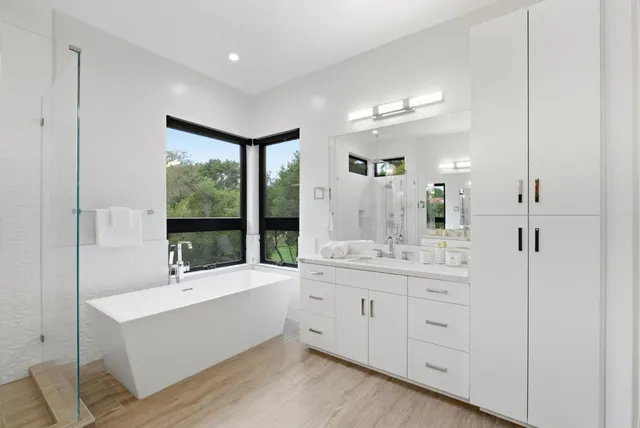 a bedroom with a large bed and a window