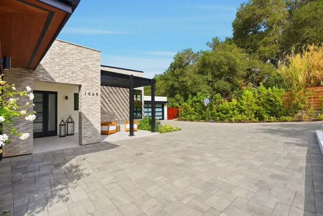 a view of a backyard with sitting area