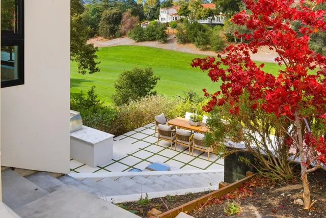 a view of a building with sitting area