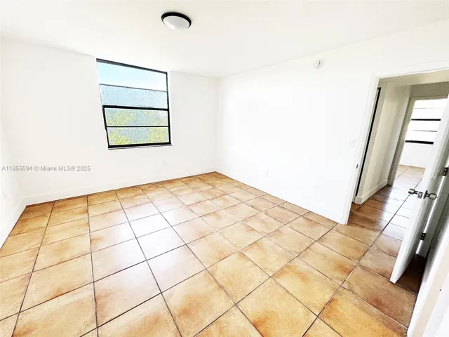 a view of a room with white walls