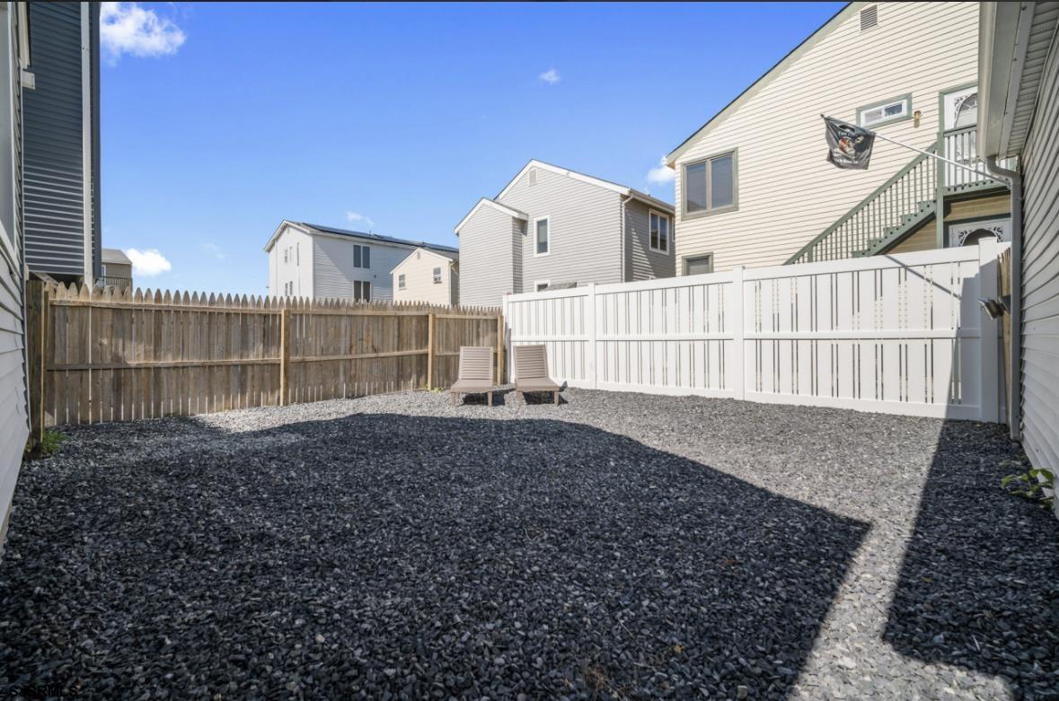 207 13th Street North Brigantine, NJ 08203 - Photo 19 of 44 a view of a house with a backyard
