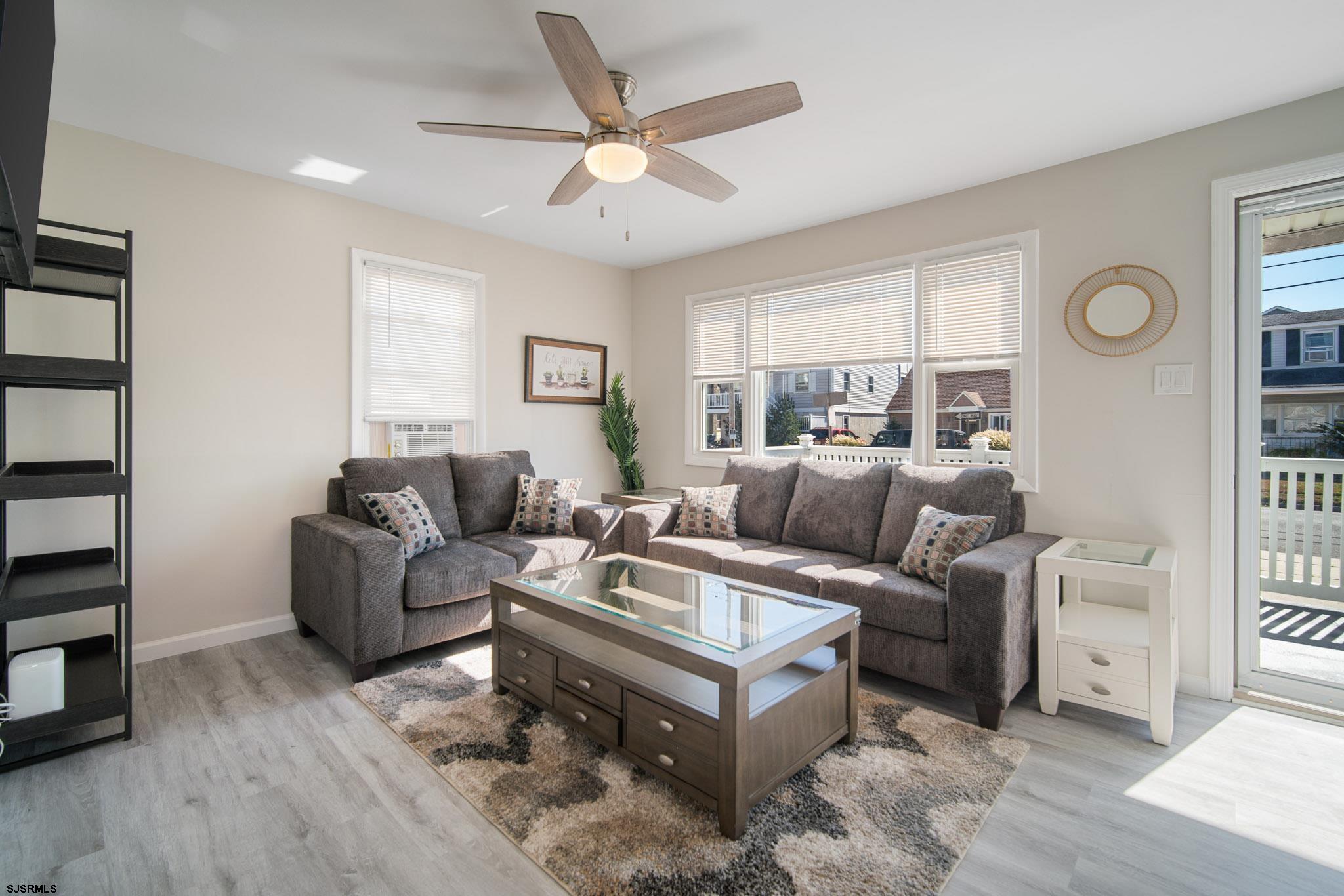 207 13th Street North Brigantine, NJ 08203 - Photo 21 of 44 a living room with furniture and a large window