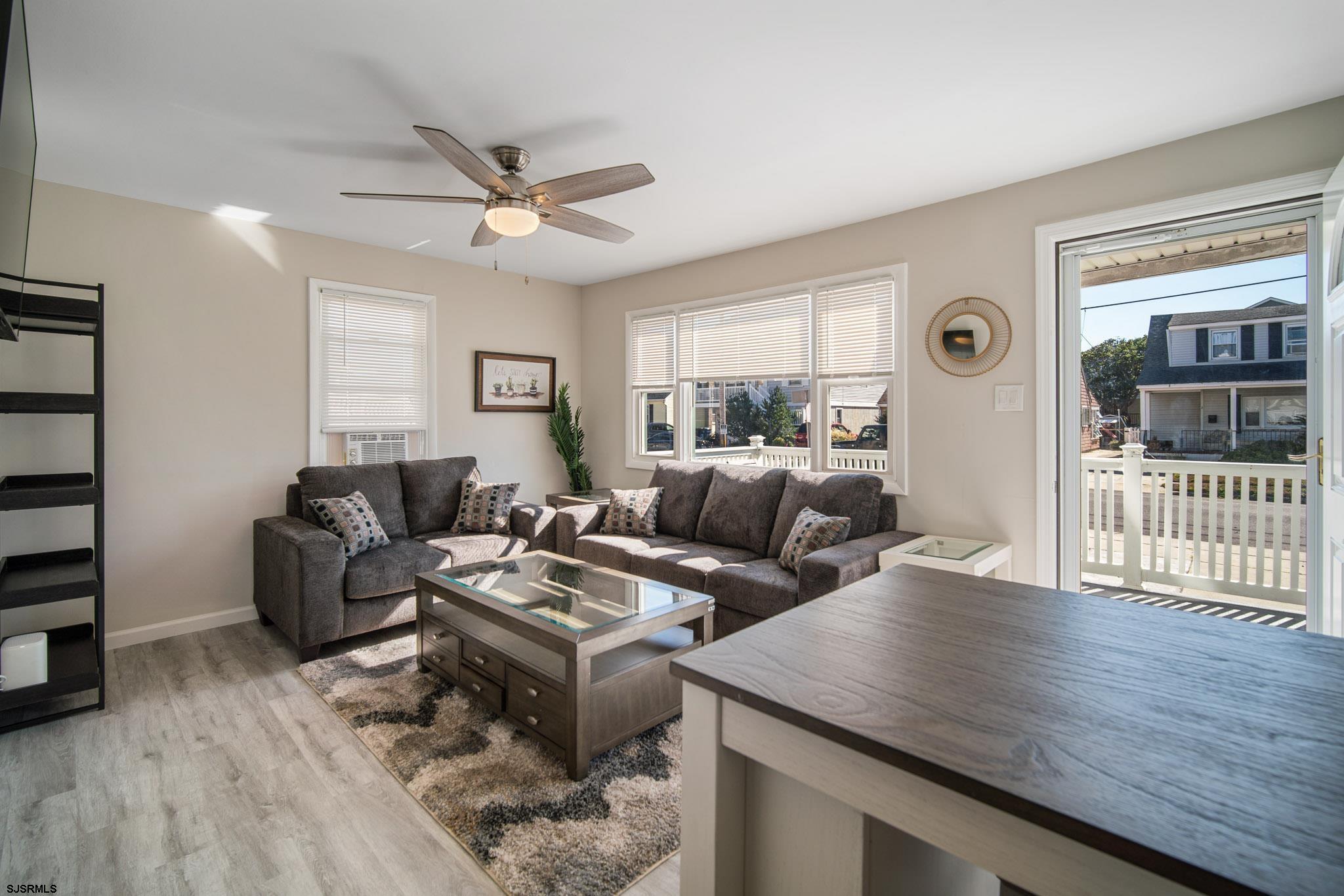207 13th Street North Brigantine, NJ 08203 - Photo 24 of 44 a living room with furniture and a window