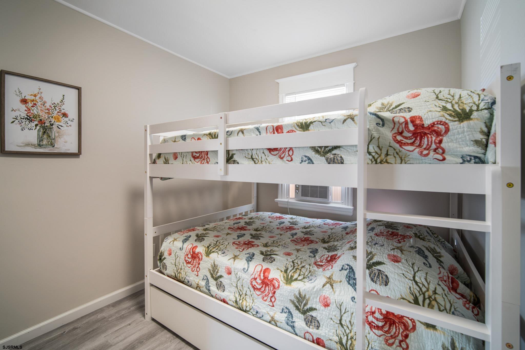 207 13th Street North Brigantine, NJ 08203 - Photo 34 of 44 a bed room with a bed and a window