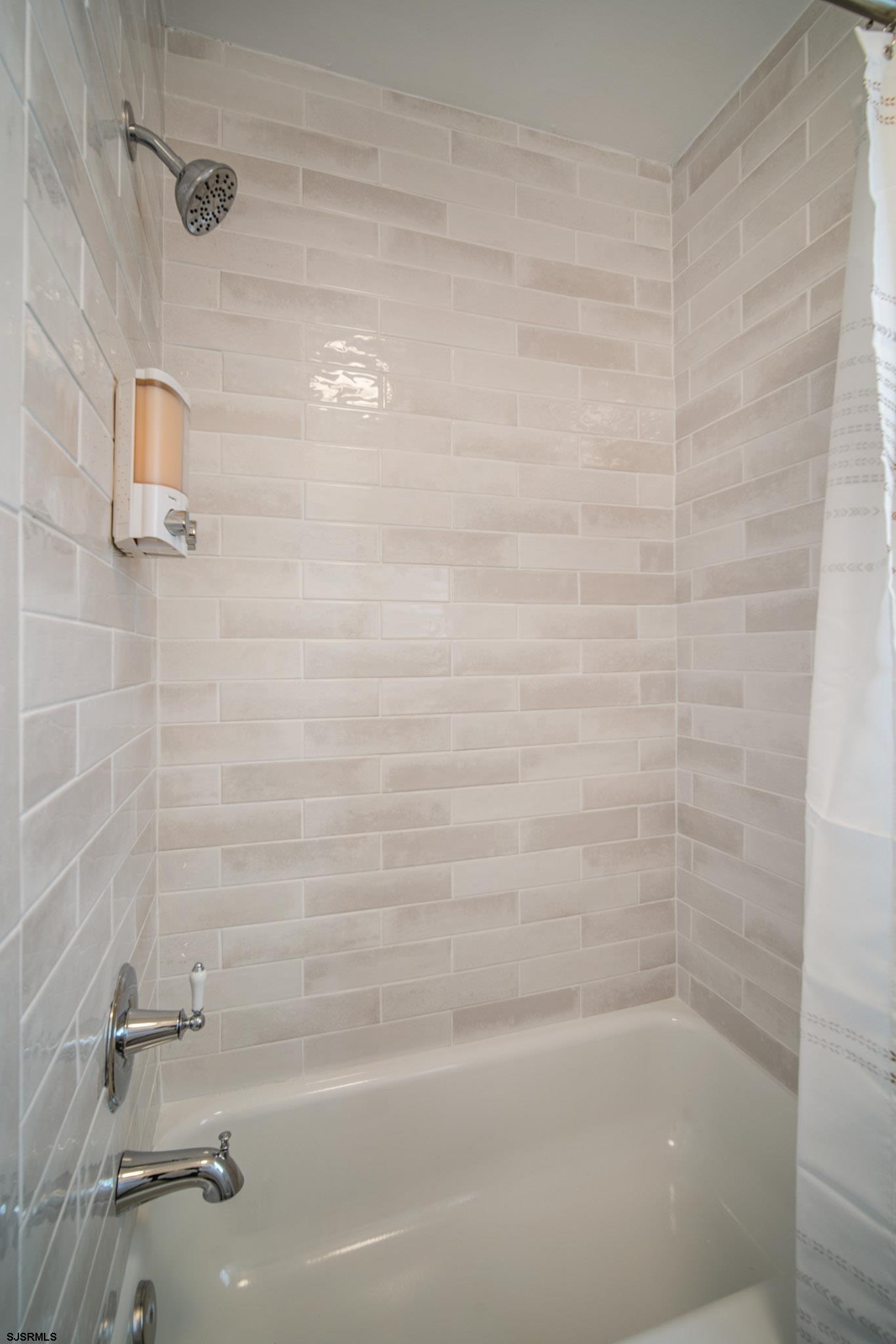 207 13th Street North Brigantine, NJ 08203 - Photo 36 of 44 a close up of a bathtub