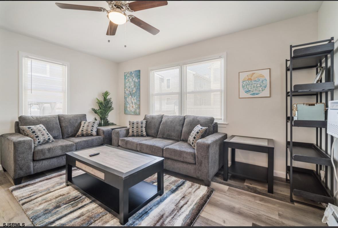 207 13th Street North Brigantine, NJ 08203 - Photo 4 of 44 a living room with furniture and a window