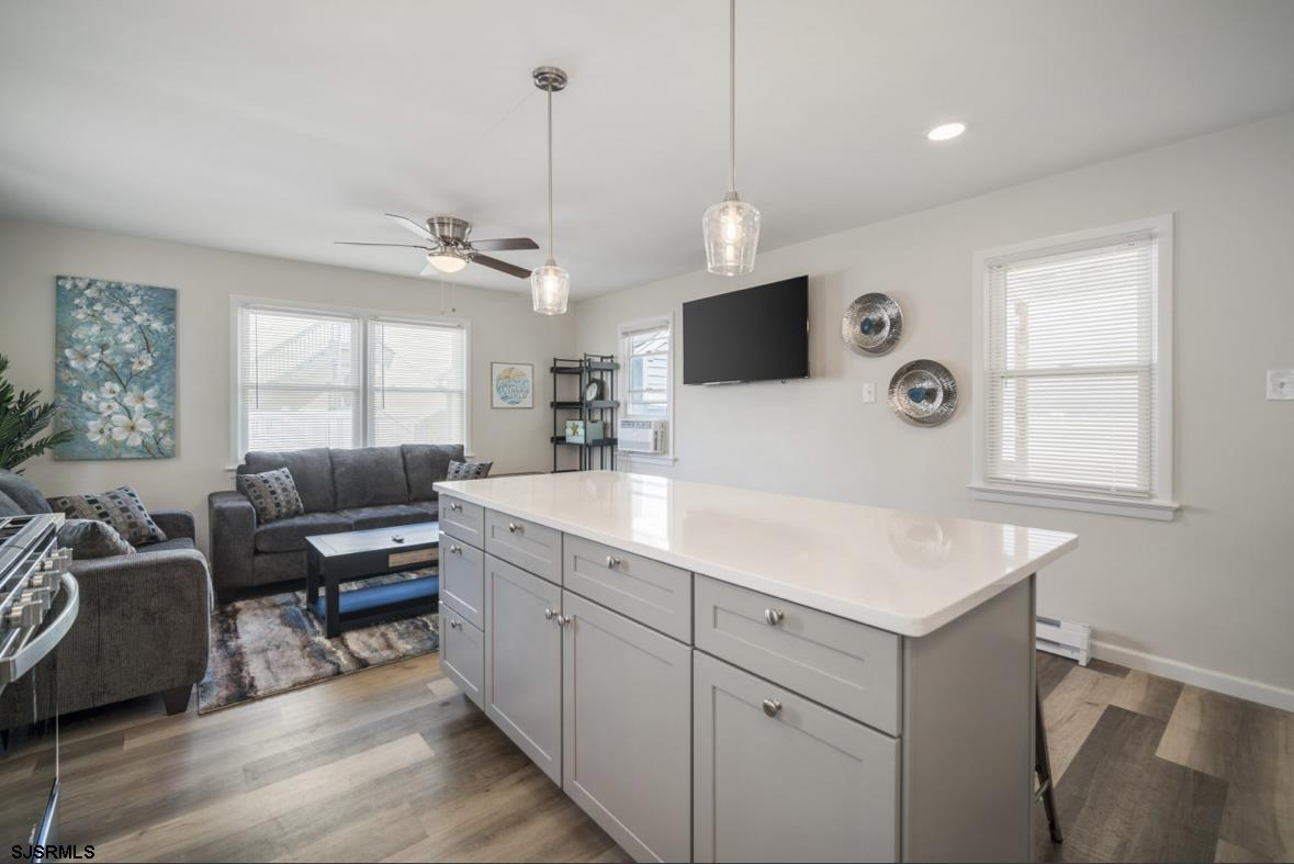 207 13th Street North Brigantine, NJ 08203 - Photo 10 of 44 a room with furniture a window and a flat screen tv